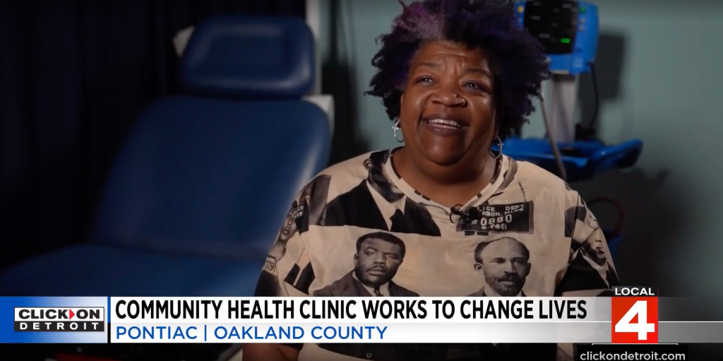 African American woman in a black and white shirt being interviewed by Local 4.